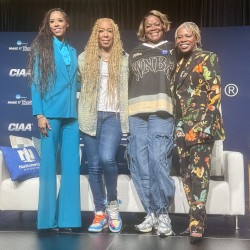 Swoopes poses for photo with others