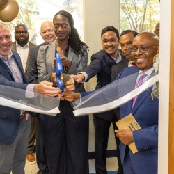 Cutting the ribbon at the opening of the lab