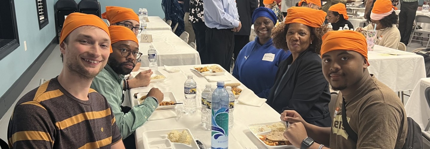 Students conversing at table for Potlucks for Pluralism