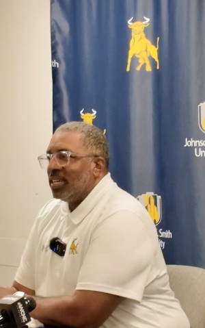 Coach Flowers speaking at the press conference in Boston before the Essence Classic